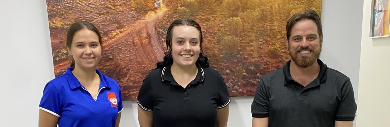 Three new St John NT recruits standing.