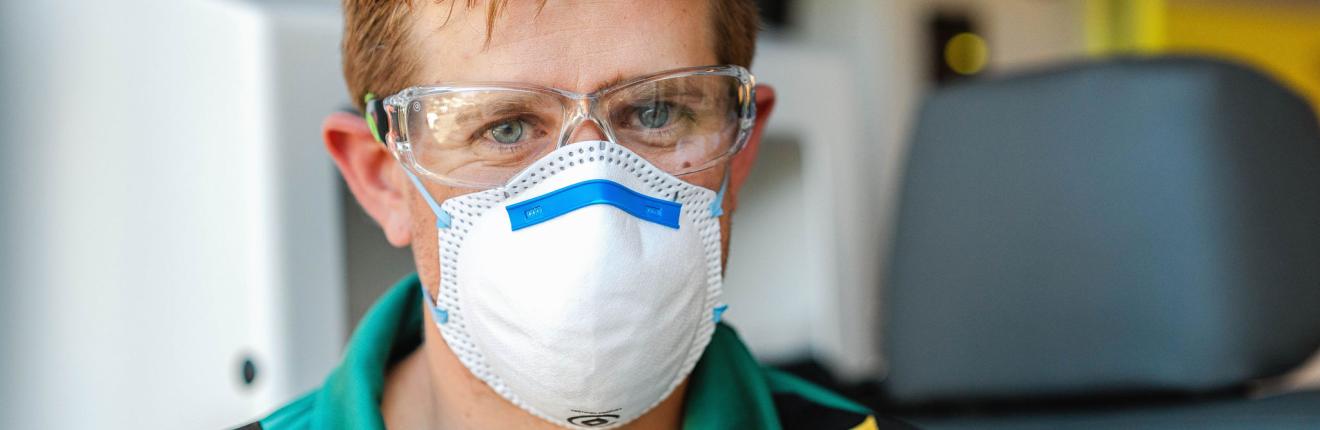 Paramedic wearing mask.