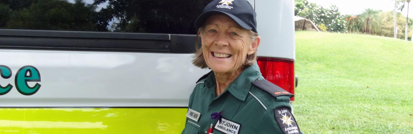 Val Eaton standing next to an ambulance.