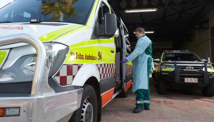 Man looking inside ambulance.