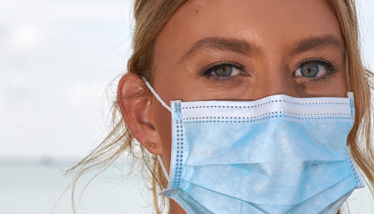 Paramedic wearing a mask.