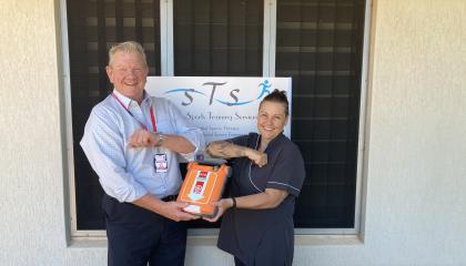 Giving Katherine business an AED.