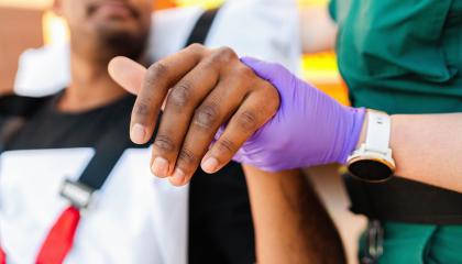 Paramedic treating patient