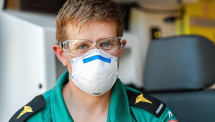 Paramedic wearing mask.