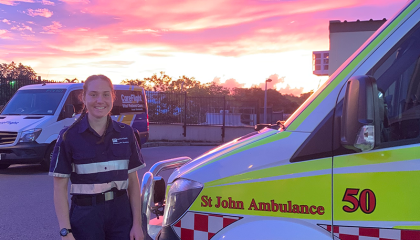 Sarah Evans standing next to an ambulance.