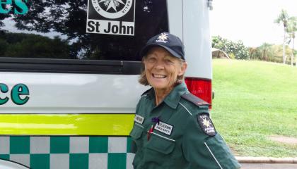 Val Eaton standing next to an ambulance.