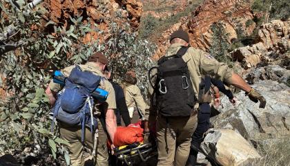 The paramedic and SAR member carrying the patient