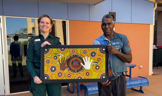 Abbey Studley and Curtis Haines pictured with new Saving Lives artwork
